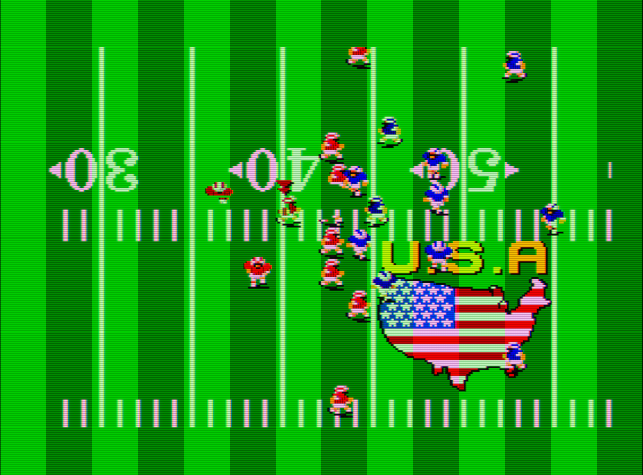 Captura de pantalla de Great Football. Dos grupos de hombrecillos enfrentan sobre un campo de fútbol americano. En el cesped del campo de ve un mapa de Estados Unidos con la bandera del país en su interior. En la parte superior del mapa se lee U.S.A