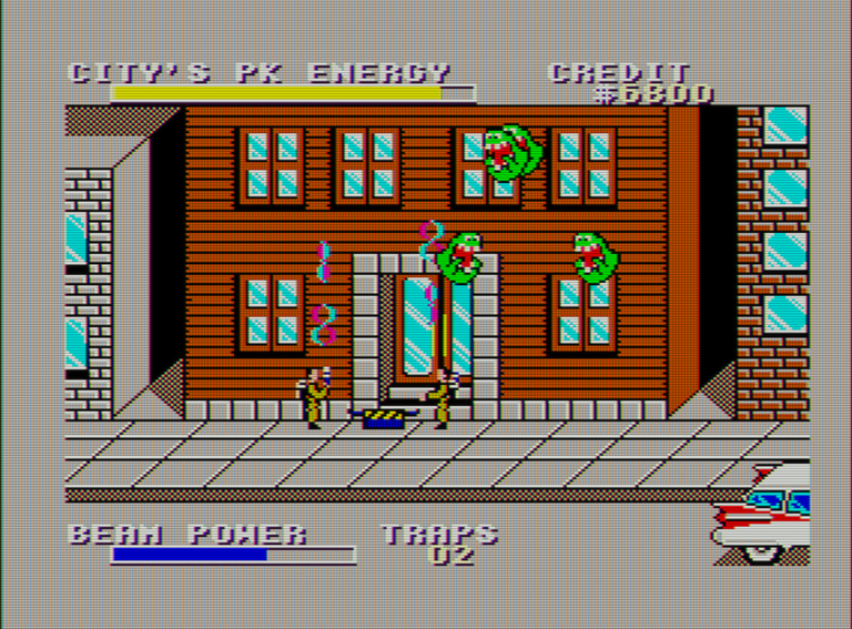 Captura de pantalla de Ghostbusters. Vista frontal de una acera frente a un edificio. En el aire vuelan varios fantasmas. En la acera hay dos personajes disparando rayos hacia arriba y una trampa entre ellos.